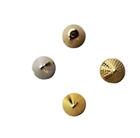 four gold metal buttons on a white background