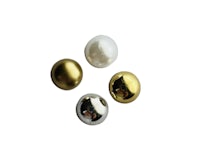 a group of gold, silver, and white beads